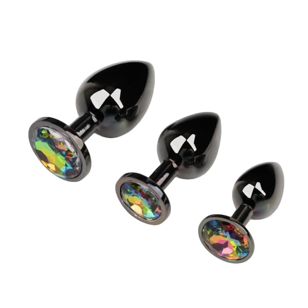 Feast your eyes on an image of Gunmetal Cute Rainbow-Colored Jewel Metal 3pcs Anal Training Set, showcasing three plugs with teardrop-head design and shimmering rainbow-colored jewels.