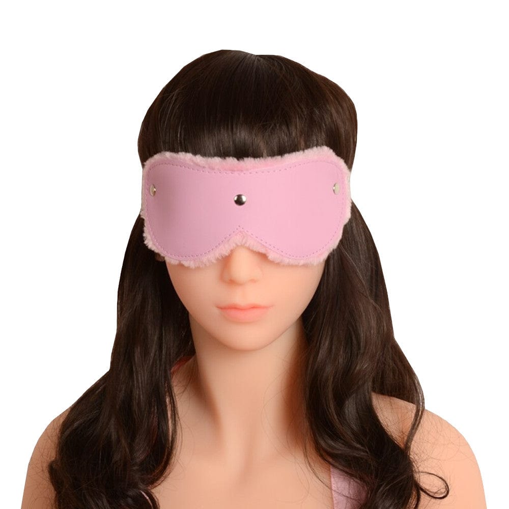 Pink furry bondage blindfold with plush inner lining and sleek PU leather exterior for sensory deprivation play.