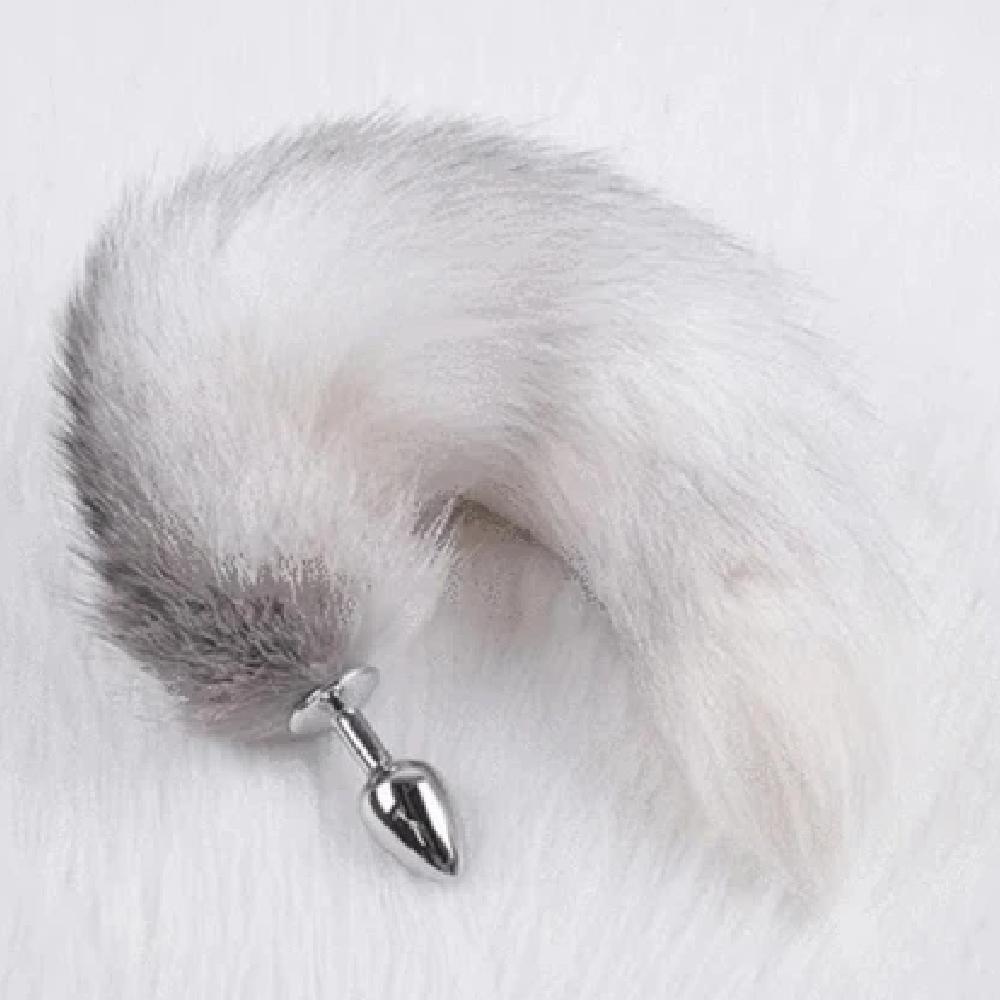 In the photograph, you can see an image of Elegant Fox Tail Plug 19 Inches Long with a high-shine stainless steel plug in silver color.