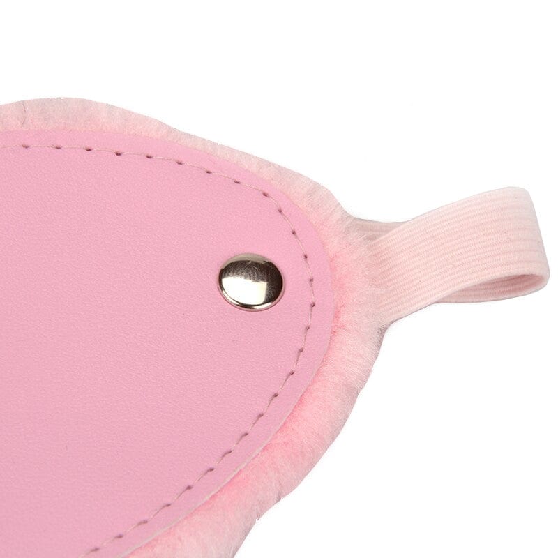 Elegant pink blindfold combining plush comfort and refined sophistication for exciting intimate moments.