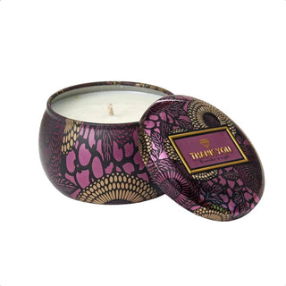 A sensual image of the warm, inviting glow of the soy candle casting a romantic atmosphere in the room.