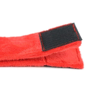 Presenting an image of Super Comfy Red Ankle and Arm Foot Cuffs, a key to unlocking a world of pleasure and intimacy with its soft texture and practical Velcro adhesives.