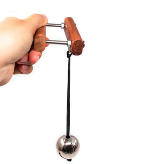 Wooden Ball Buster Compressor, a devious device for exploring desires and sensations.