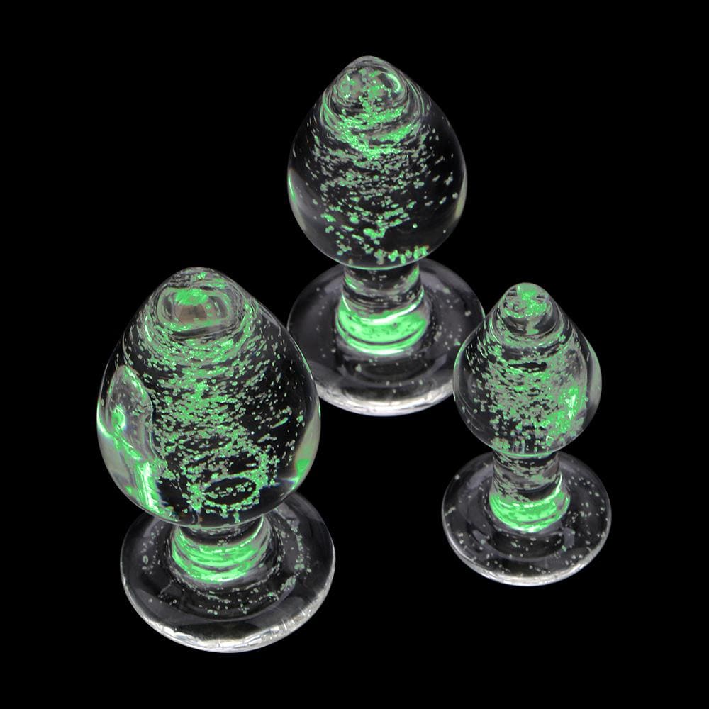 Image of glow-in-the-dark glass butt plug with sleek design