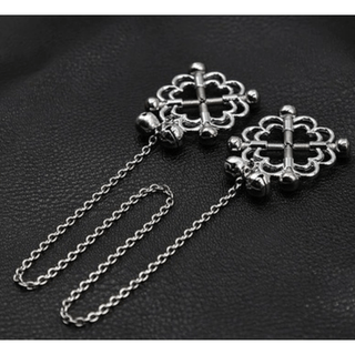 Faux nipple rings with intricate flower design and adjustable screws for comfort and pleasure.