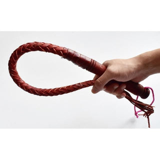 This is an image of the Old School Punishment Kink Scourge Sex Whip, a 27.56-inch leather whip with a wooden handle for luxury and comfort in intimate experiences.