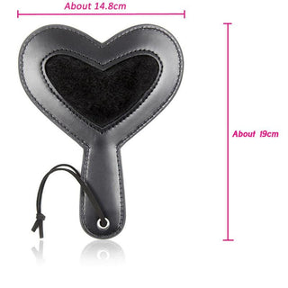 This is an image of a plushy heart paddle with a wrist sling for secure grip during intimate adventures.