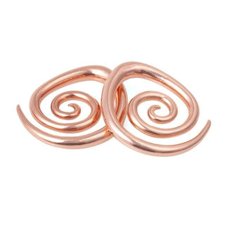 Check out an image of Spiral Taper Stretched Nipple Piercings crafted from smooth copper, offering comfort and captivating charm for a mesmerizing performance.