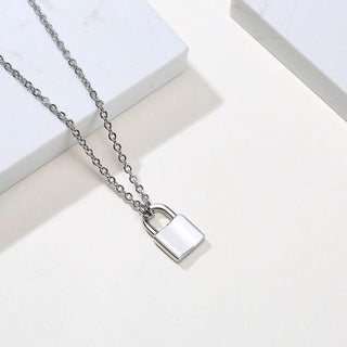 Featuring an image of Tiny Lock Chain Necklace, highlighting its durability and comfort with high-quality stainless steel.
