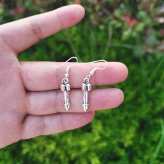 This is an image of Penis Earring Fetish Jewelry crafted from stainless steel, zinc alloy, silver, and copper for durability and style.