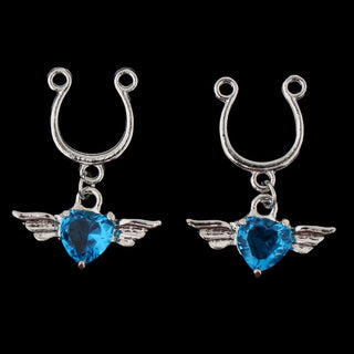 A close-up image of Winged Gem Fake Nipple Piercings with a mirror-polished finish for a luxurious touch.