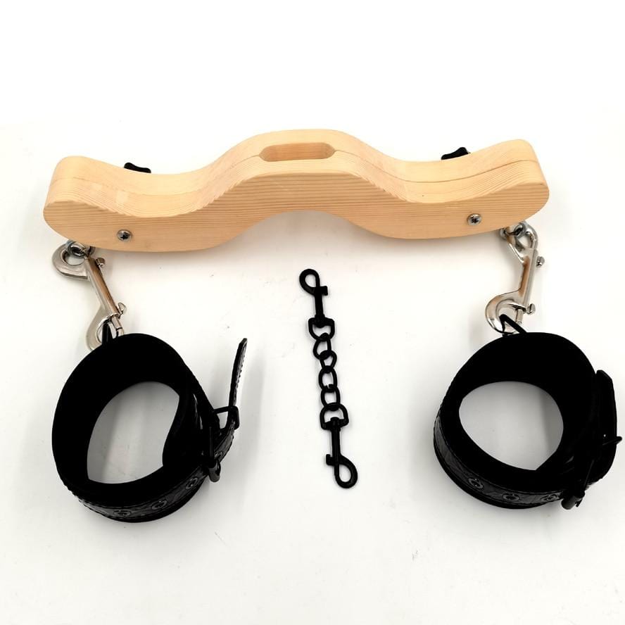 Wooden humbler with ankle cuffs and chain for BDSM dominance and control.