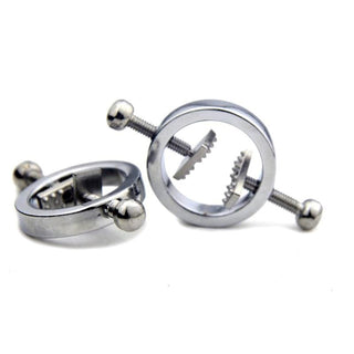 A close-up of faux piercing barbells designed for pierced and non-pierced nipples, featuring adjustable screw pressure for added excitement.