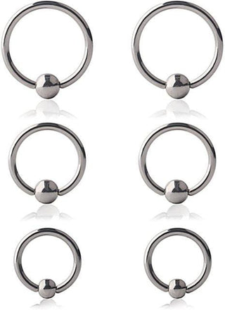 This is an image of Surgical Grade Frenum Ring Piercing, designed for pleasure and performance, crafted with precision to enhance intimate moments with a sleek and minimalist design.