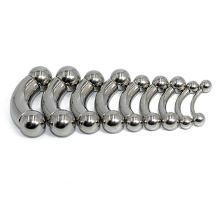This is an image of Tough Guy Prince Albert Curved Barbell Piercing, designed to elevate intimate pleasure with its unique curved jewelry piece.