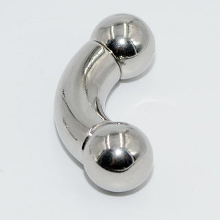 Pictured here is an image of Tough Guy Prince Albert Curved Barbell Piercing, available in silver color and various dimensions to enhance intimate moments.