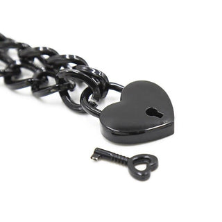 Iron chain necklace with heart-shaped lock for tactile reminders of passion.