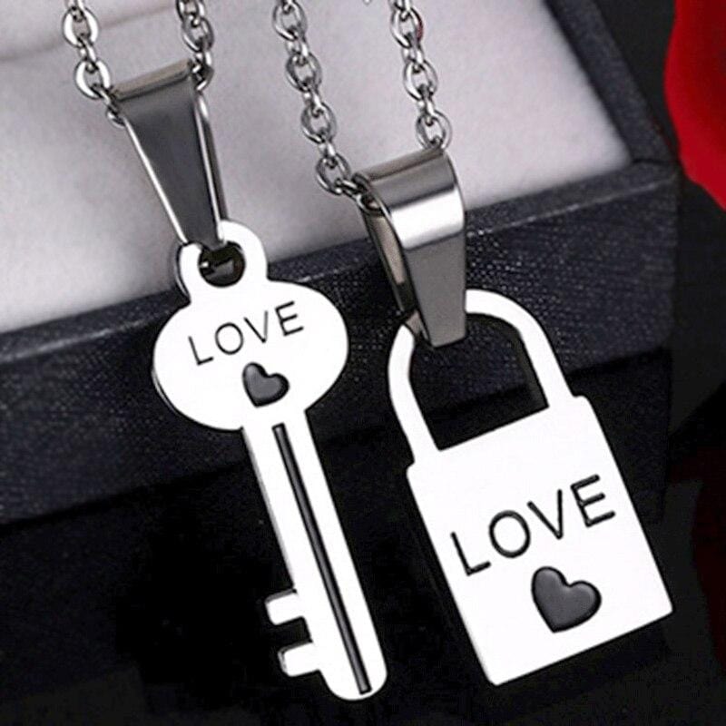 A silver-hued lock and key pendant necklace set, a perfect gift for engagements, anniversaries, birthdays, or expressing love on any day.