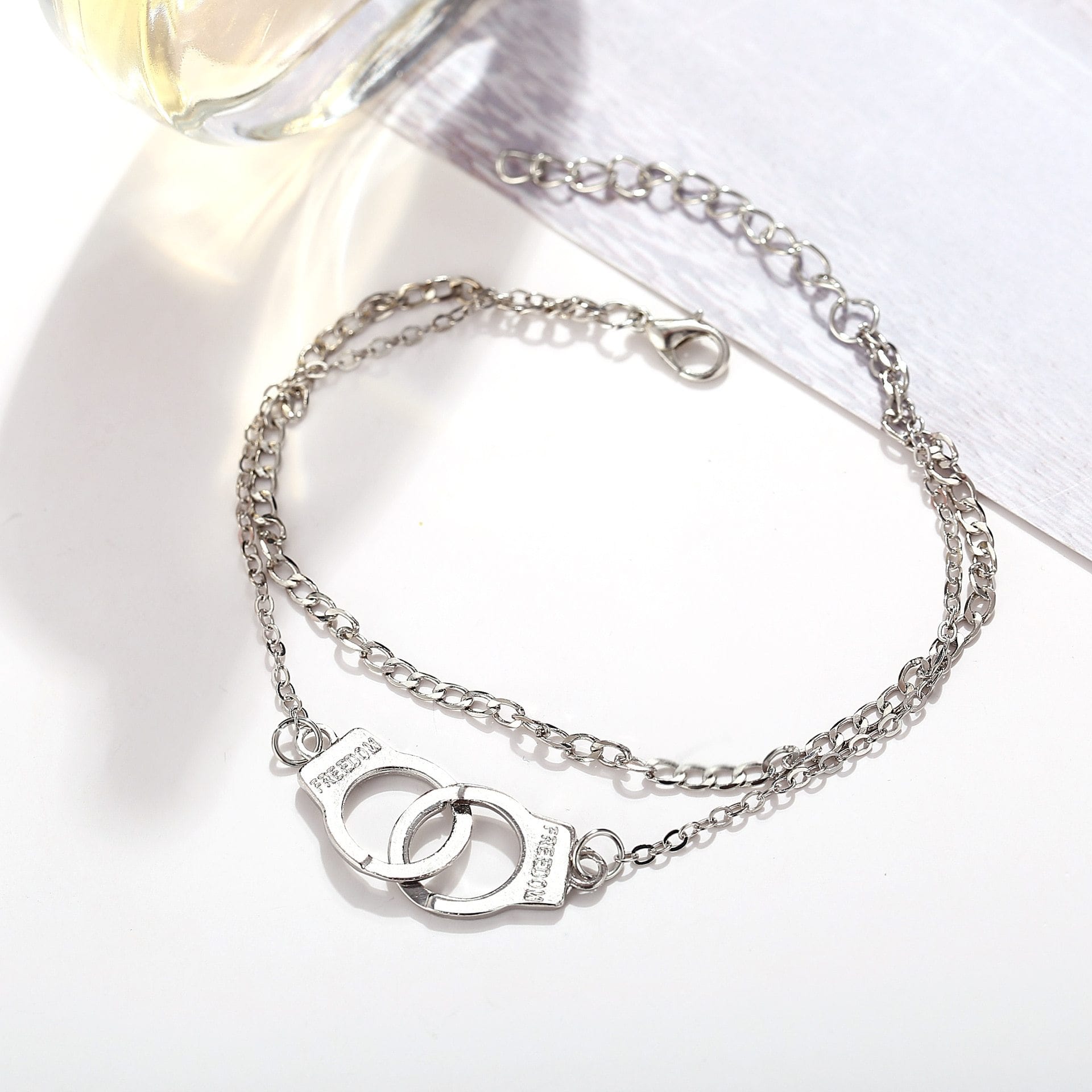 You are looking at an image of handcuffs-inspired sexy anklets with a plant pattern in silver, 20+5cm in length, from Miss JQ.
