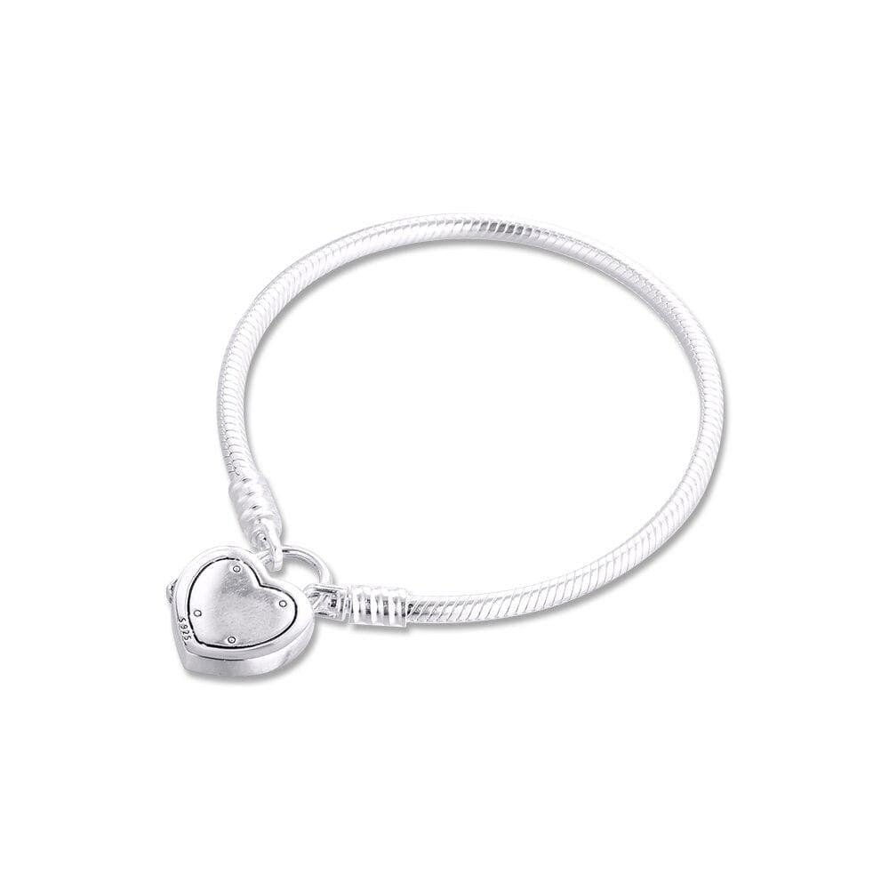 Stylish chain & link bracelet with heart charm for women, made of authentic sterling silver.