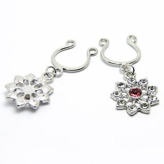 Stainless steel faux nipple rings with intricate flower motif charm and crimson gem center.