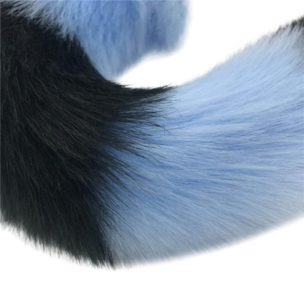 Take a look at an image of Mythical Blue Wolf Tail Plug designed for temperature play, featuring a metal plug and luxurious synthetic fur handle.