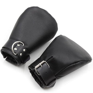Supple leather mittens for pet play, offering comfort and control with versatile D-rings for exploration.