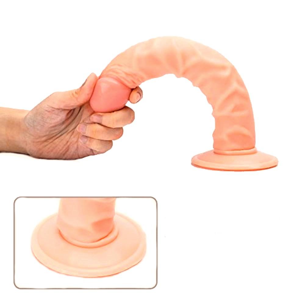 Observe an image of Real Deal 9 Inch Dildo With Suction Cup, a firm yet squishy dildo for realistic sensations.